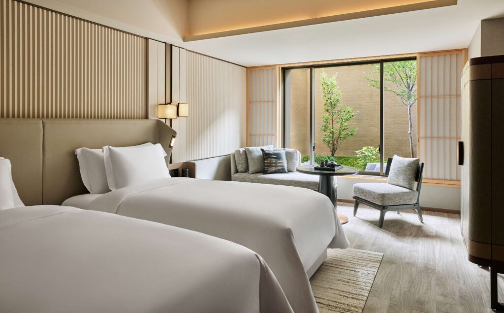 Twin guest room overlooking a garden at Dusit Thani Kyoto