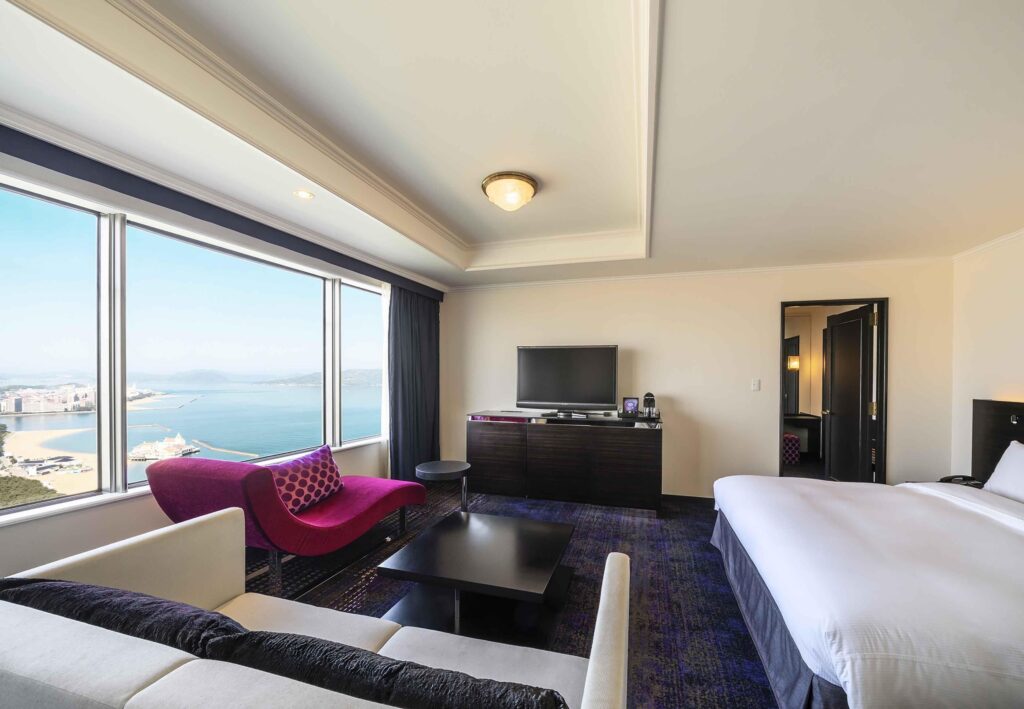 Guest room with a seating area and Hakata Bay views at Hilton Fukuoka Sea Hawk