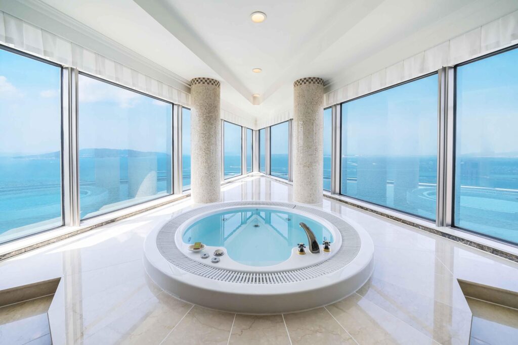 Circular jetted tub with panoramic bay views at Hilton Fukuoka Sea Hawk