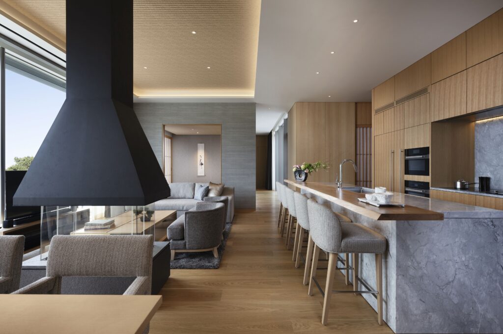 Setsu Niseko suite with full kitchen, dining counter and fireplace