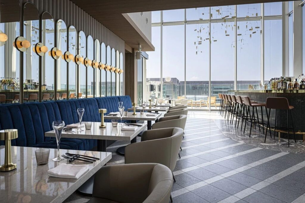 Restaurant and bar interior with floor-to-ceiling windows at Miyako Hotel Hakata