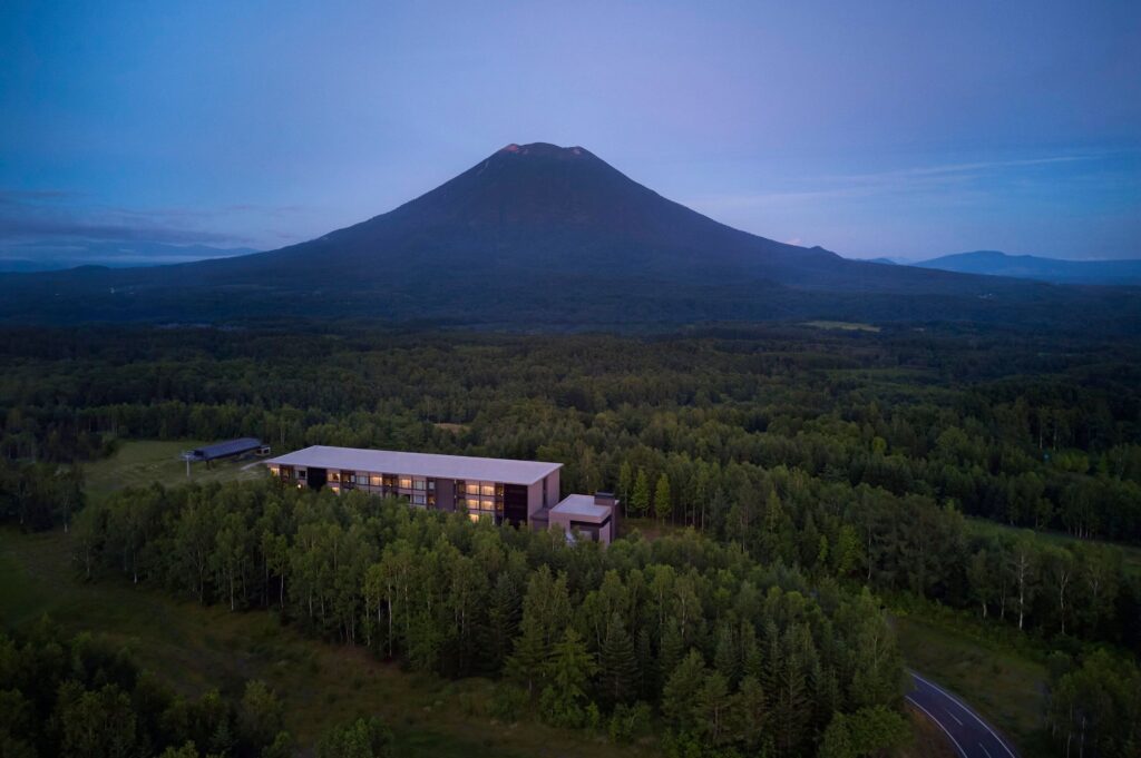 Higashiyama Niseko Village surrounded by forest beneath Mount Yotei