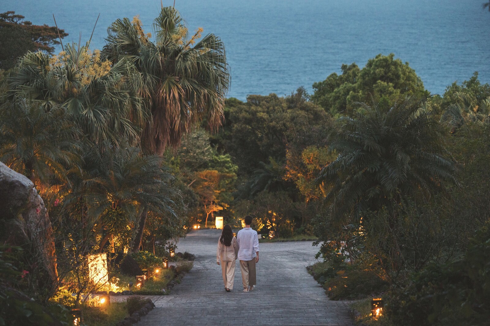 Tropical garden path between villas at sankara hotel and spa Yakushima