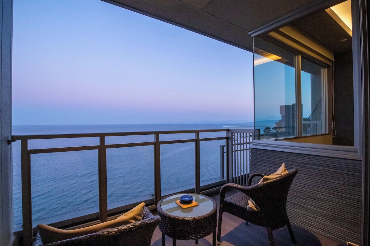 Ocean-view balcony at AMANE RESORT SEIKAI overlooking Beppu Bay