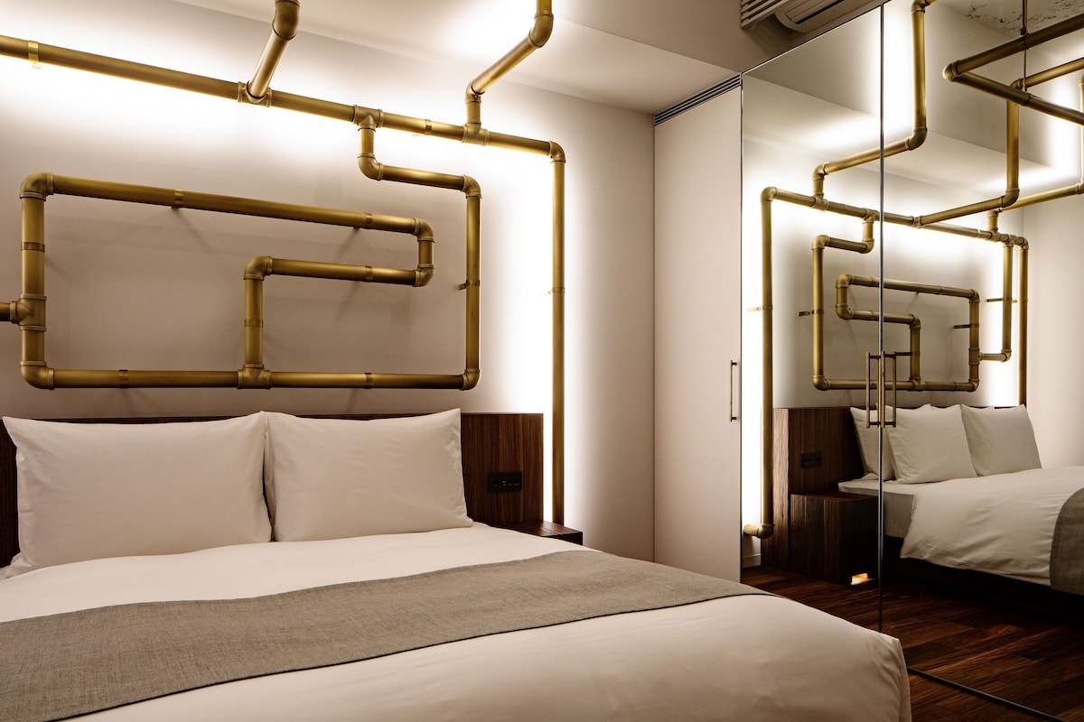 Leandro Erlich concept room with exposed brass-pipe artwork at SHIROIYA HOTEL