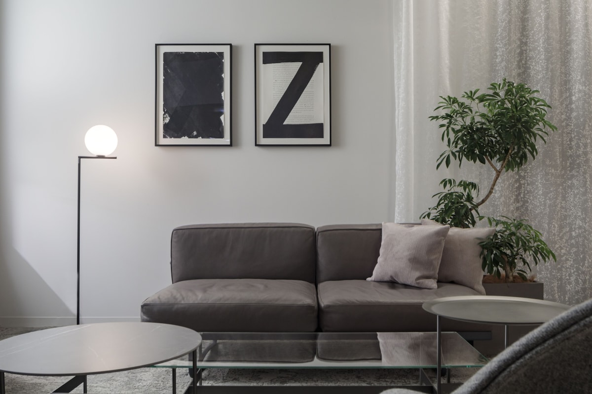 Art-filled suite living area at SHIROIYA HOTEL in Maebashi