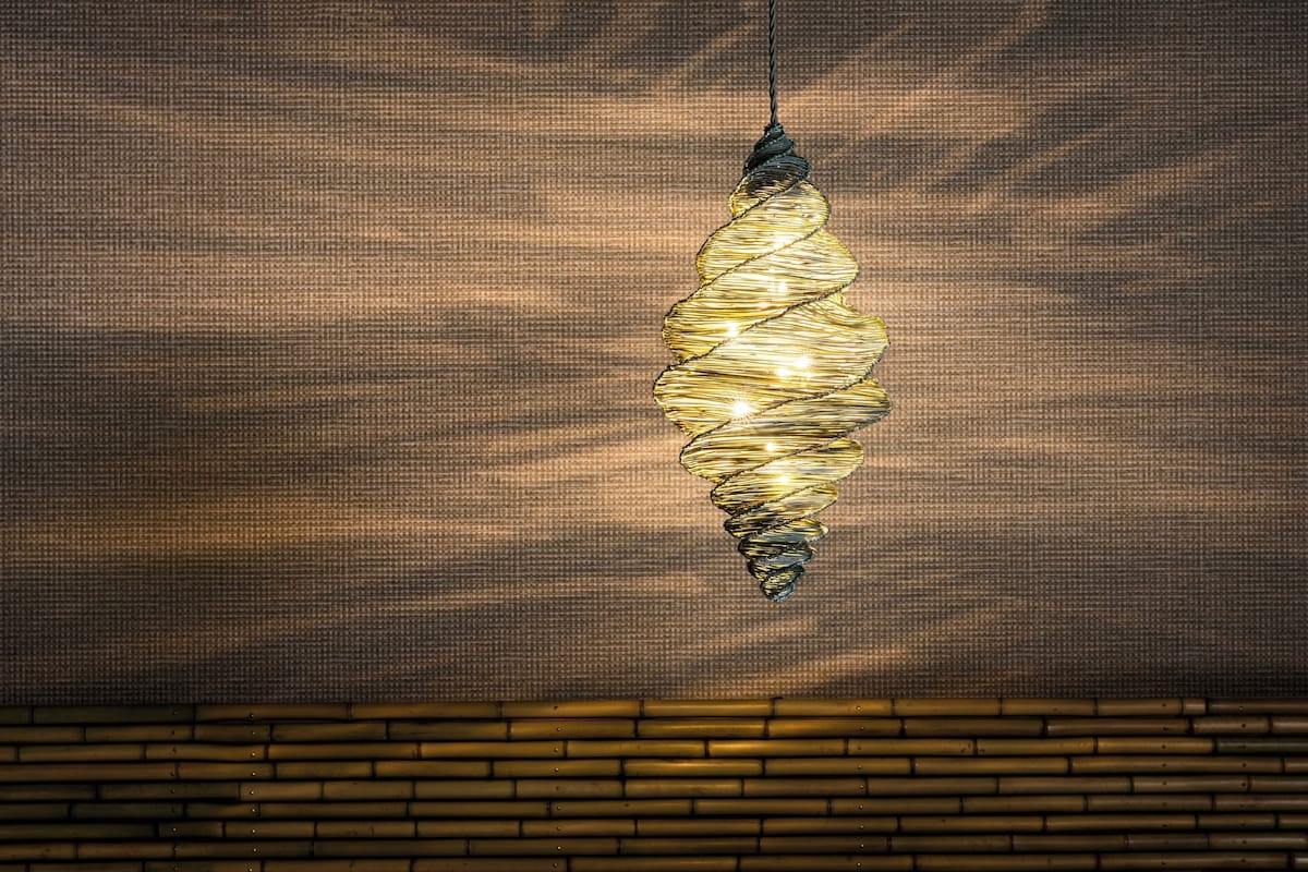 Firefly-basket-inspired woven lamp in a KAI Yufuin guest room