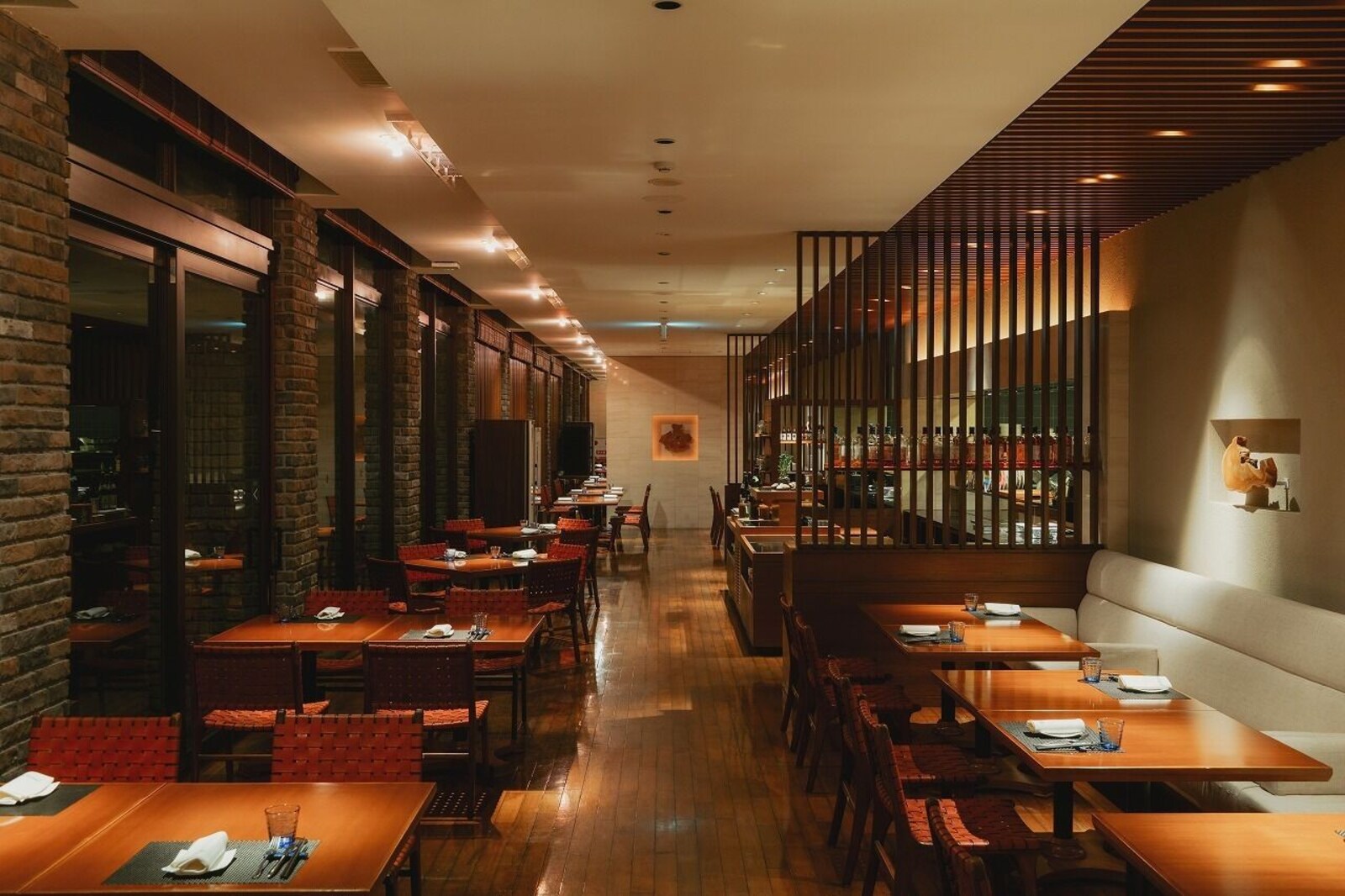 Warmly lit restaurant interior at sankara hotel and spa Yakushima