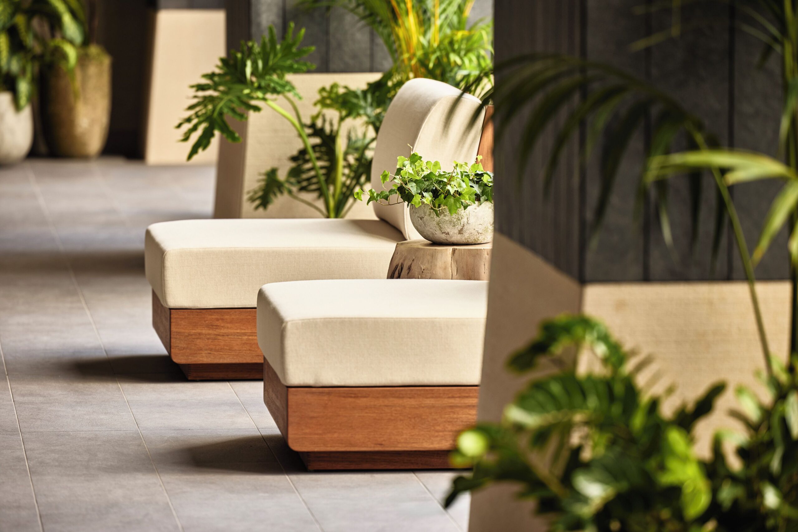 Indoor pool surrounded by greenery at 1 Hotel Tokyo