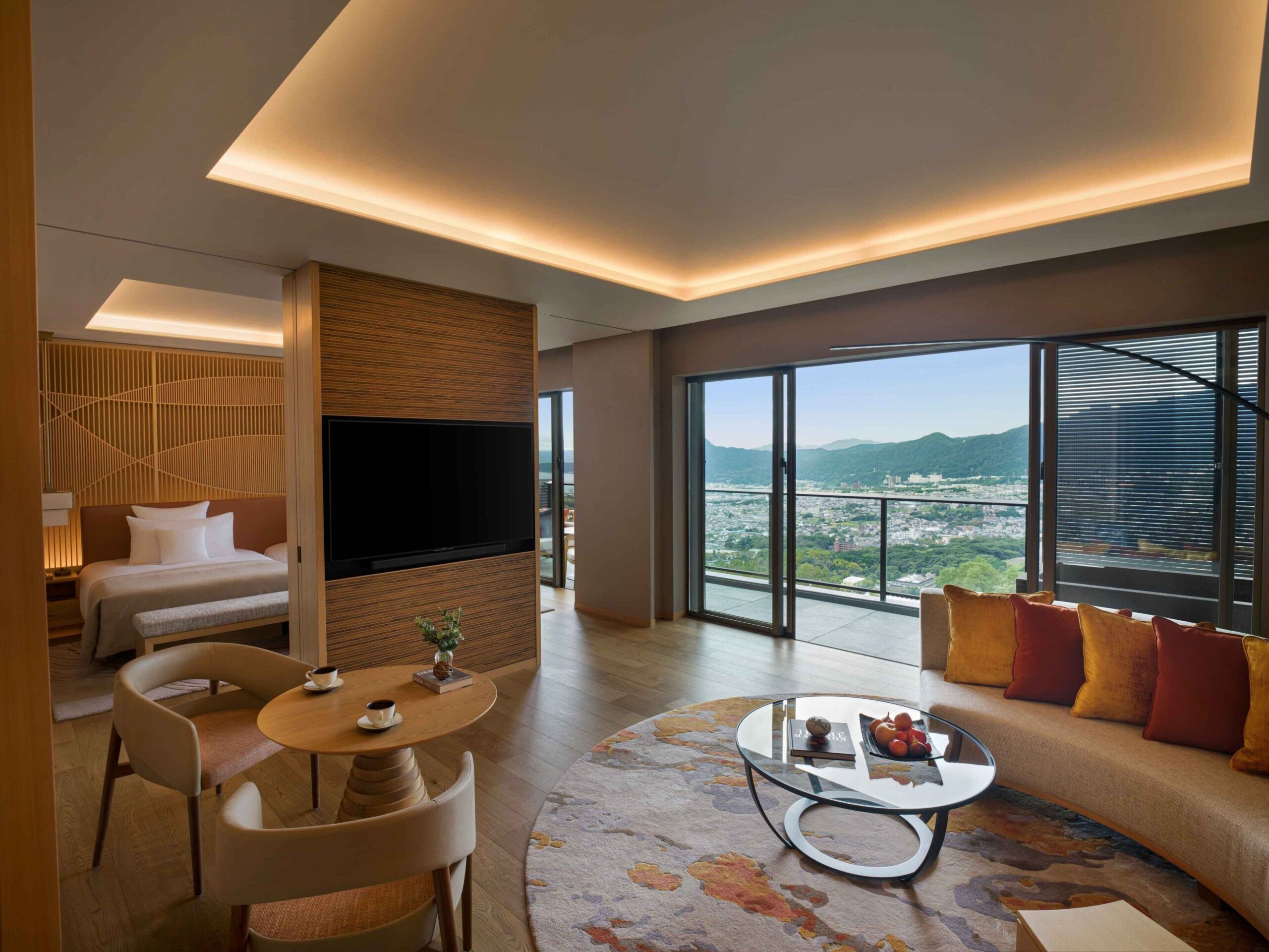 Classic room at ANA InterContinental Beppu with sofa and views across Beppu