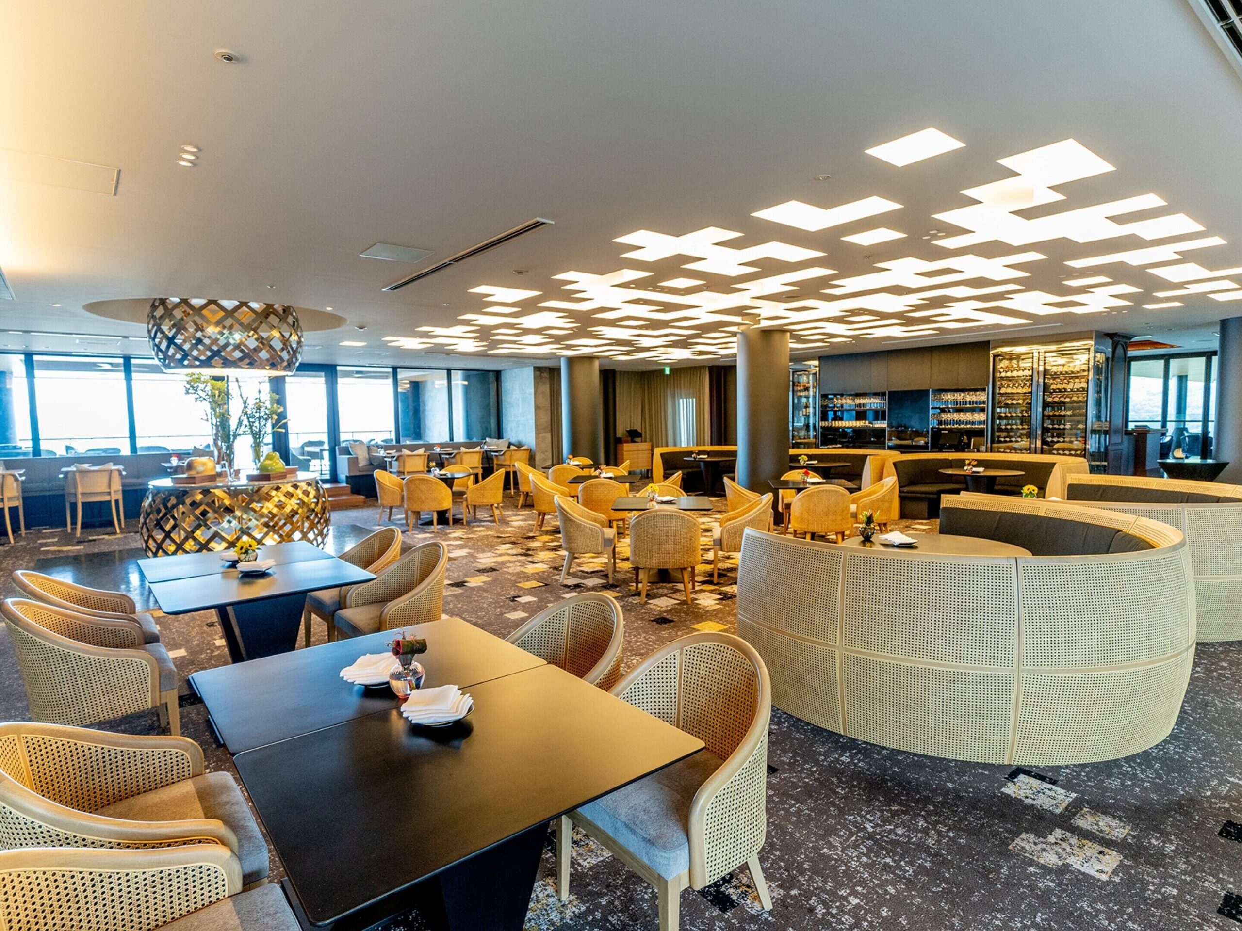 Contemporary lounge at ANA InterContinental Beppu framed by regional materials and city views