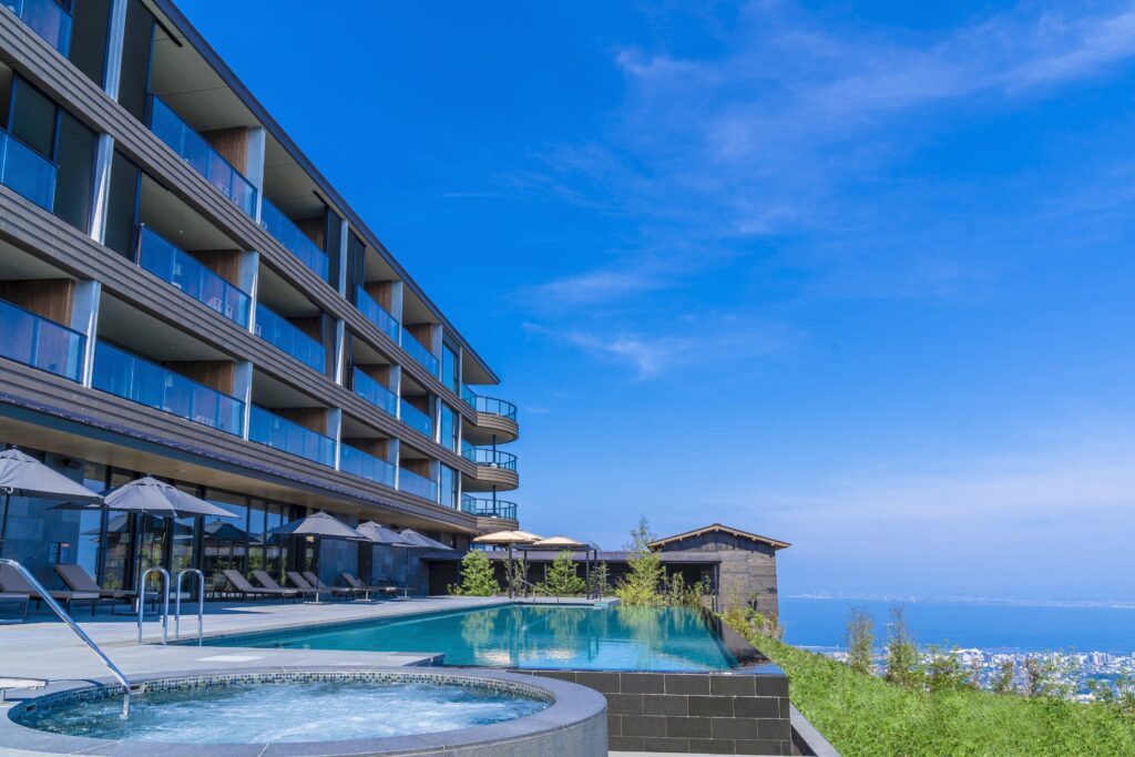 Infinity pool at ANA InterContinental Beppu overlooking Beppu and the surrounding hills