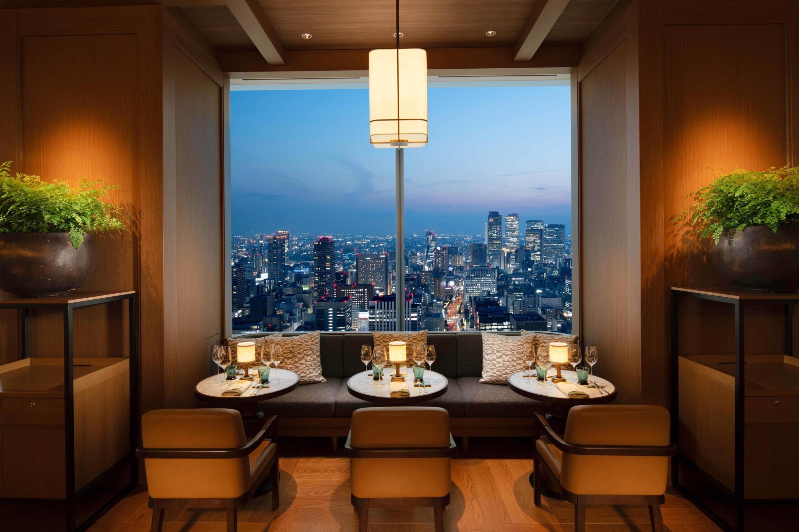 Dining room overlooking the evening skyline at Conrad Nagoya