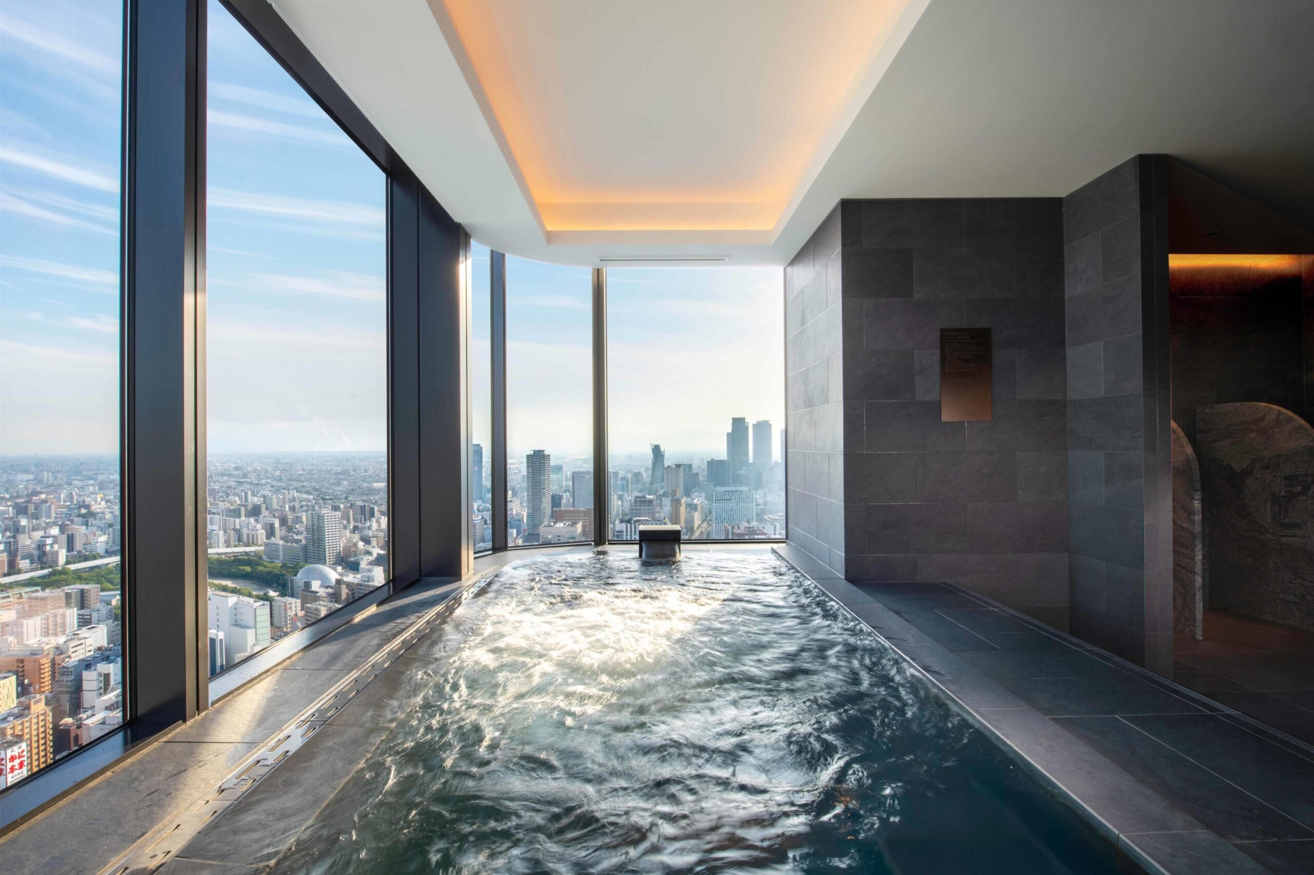 Light-filled indoor pool overlooking the city at Conrad Nagoya