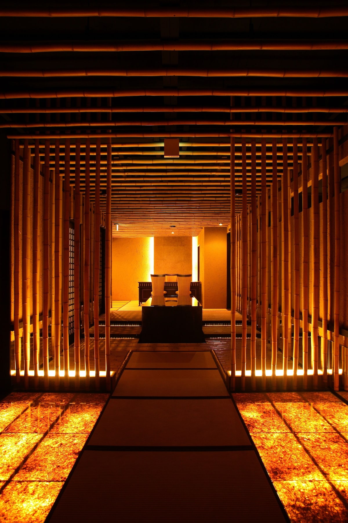 Illuminated bamboo corridor inside Kinnotake Sengokuhara