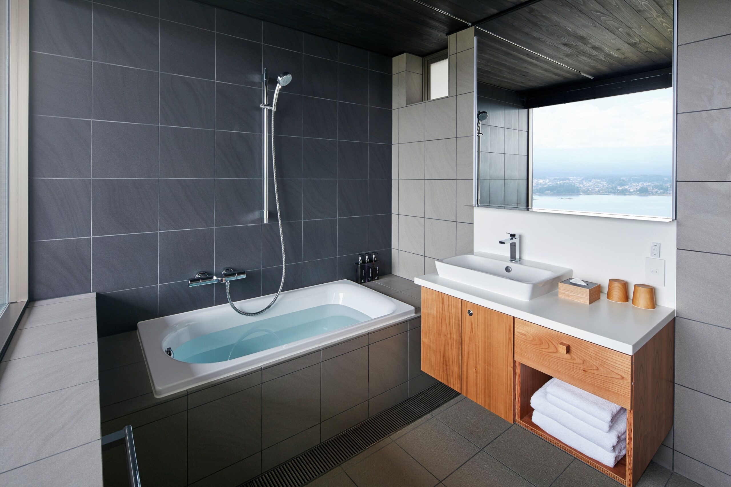 HOSHINOYA Fuji cabin bathroom with a deep soaking tub and Lake Kawaguchi view