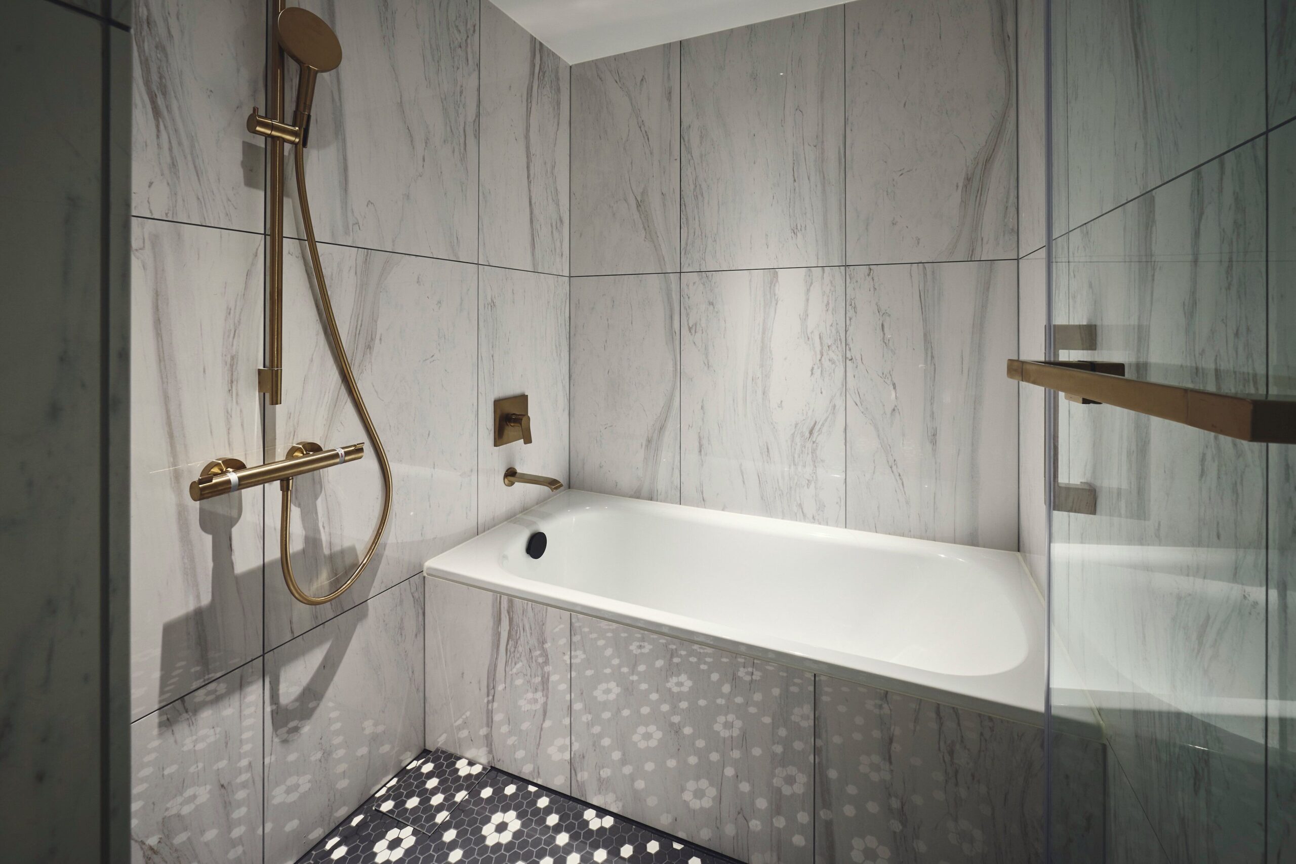 Guest bathroom with a freestanding bathtub at Hotel Indigo Nagasaki