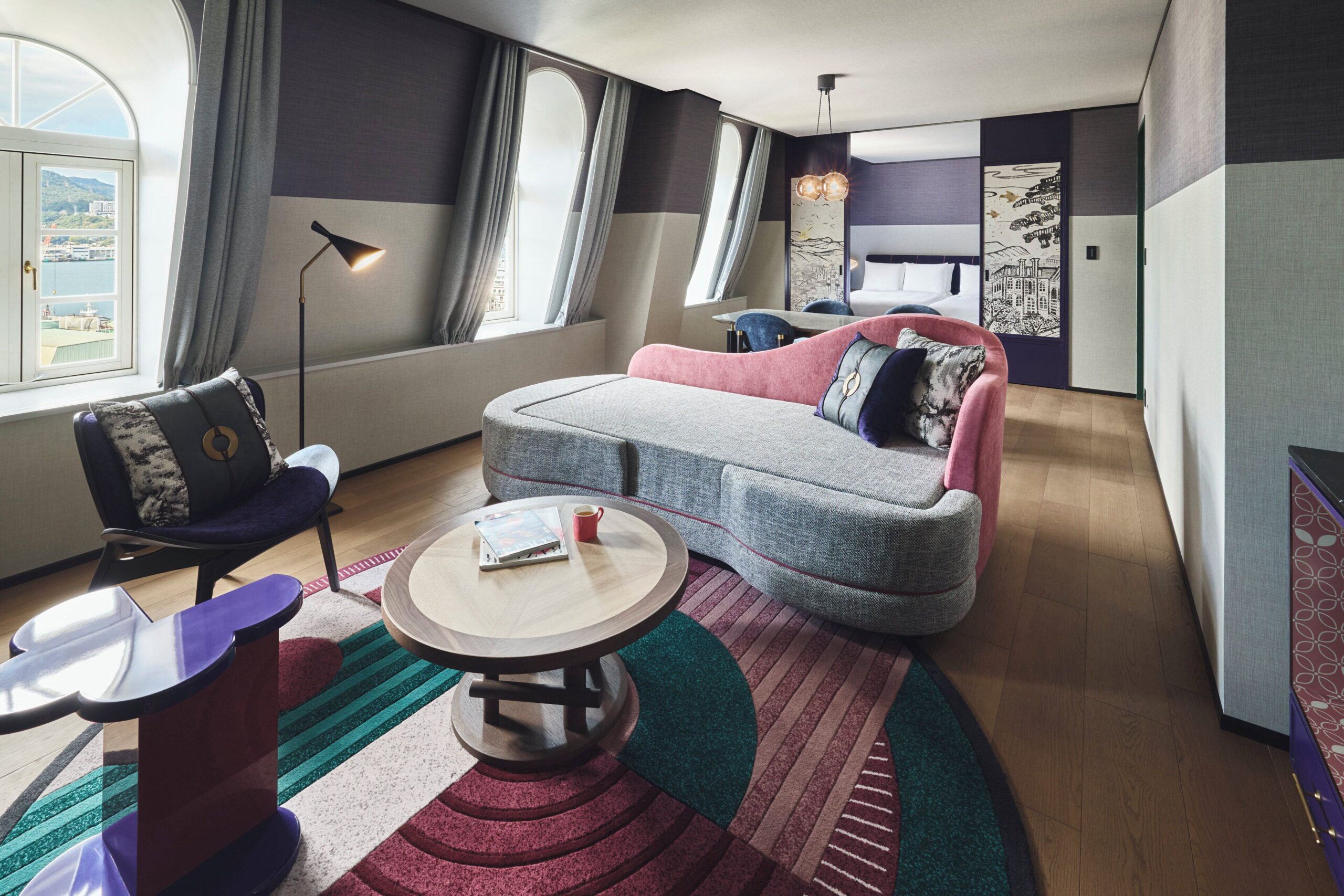 Suite living area with city views at Hotel Indigo Nagasaki Glover Street