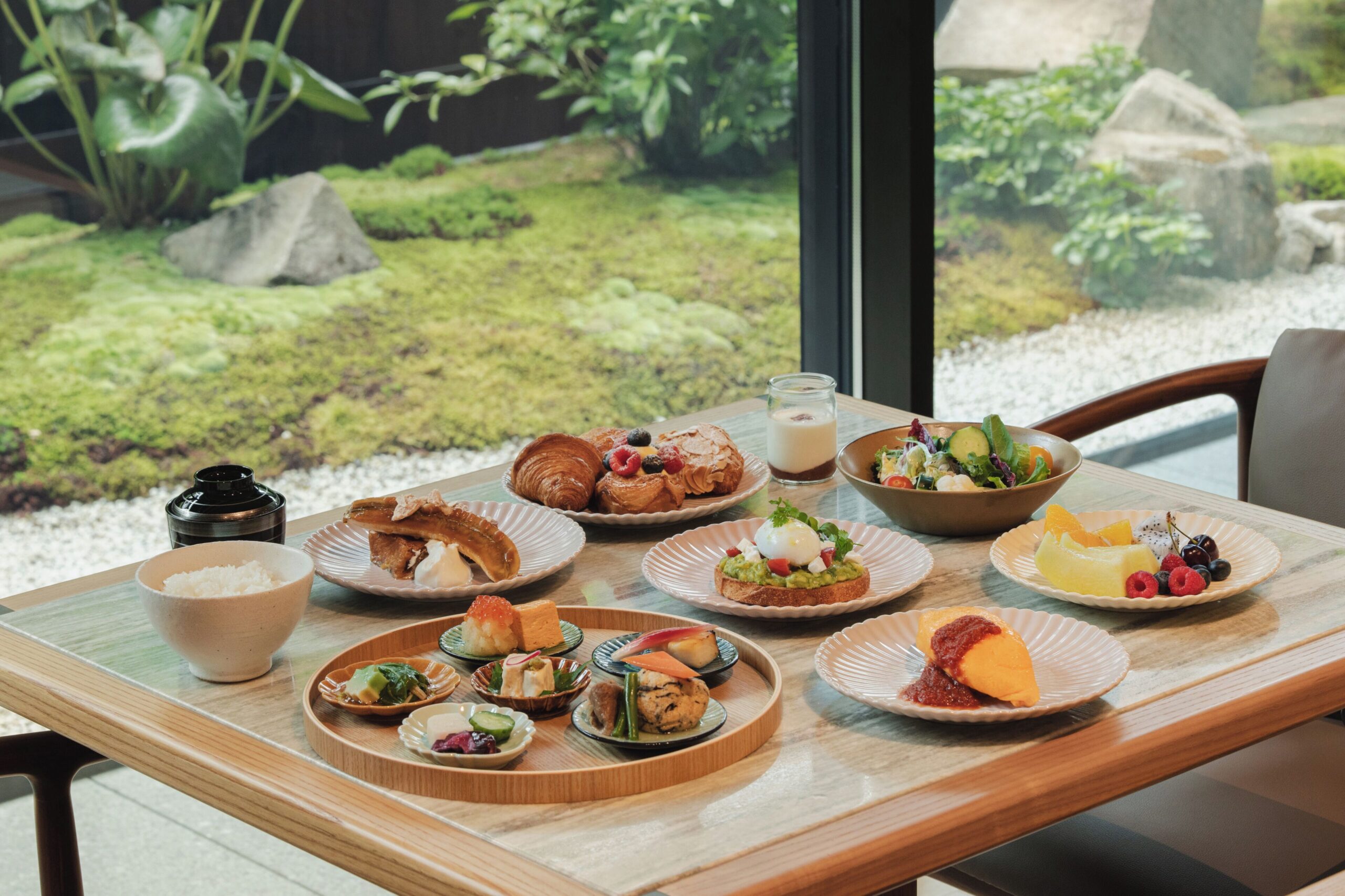 Breakfast dishes beside a garden-facing window at Capella Kyoto