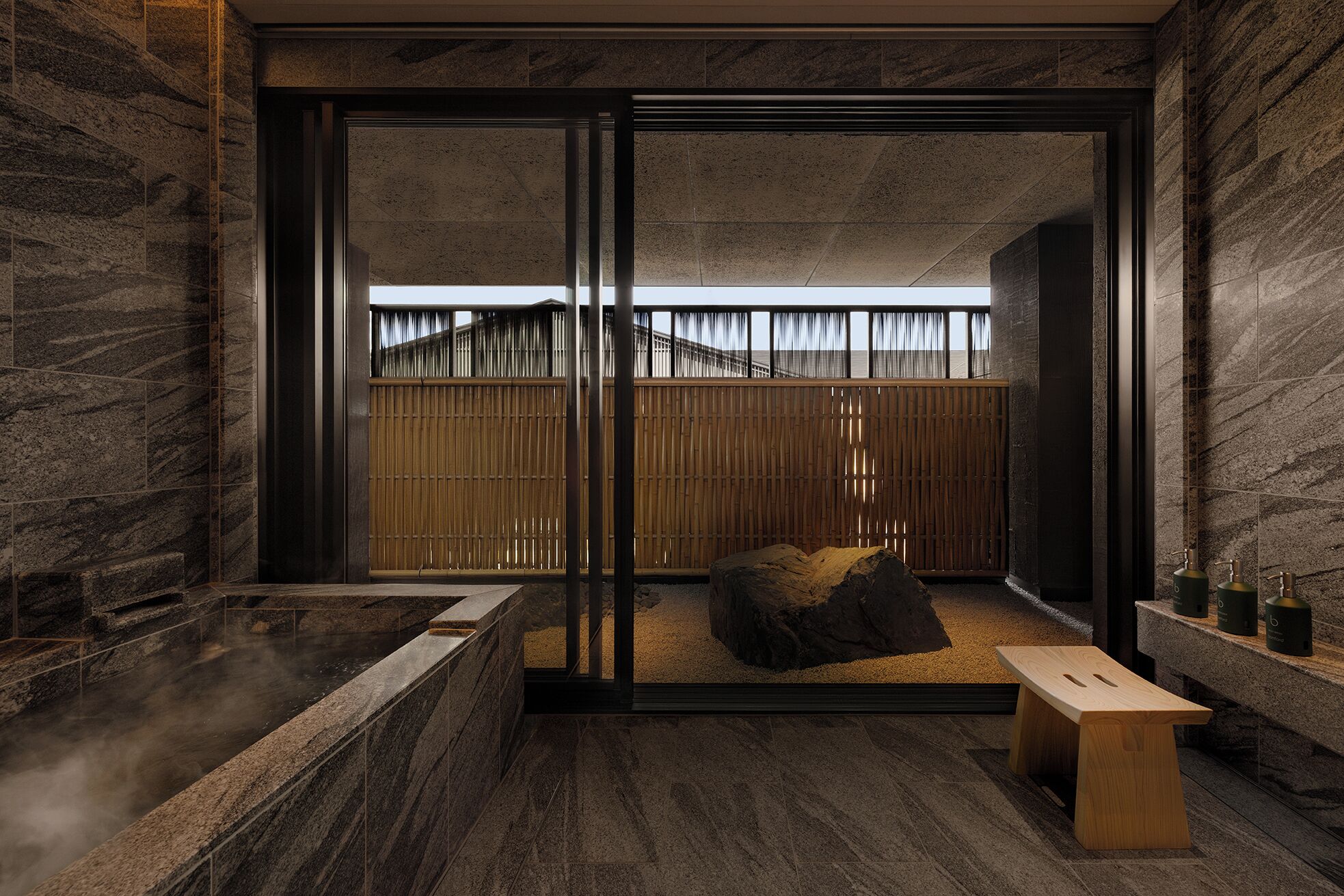 Bath in an Onsen Suite at Capella Kyoto facing a rock garden and bamboo screen